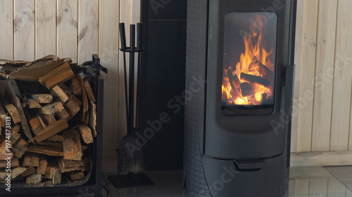 Burning wood in a potbelly stove.