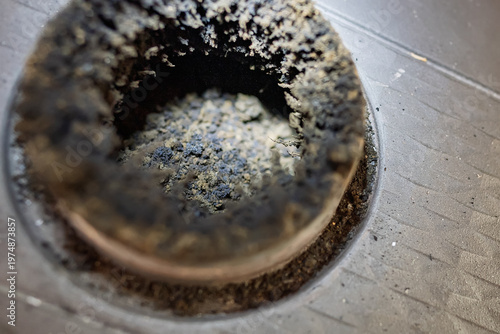 The chimney is overflowing with soot.