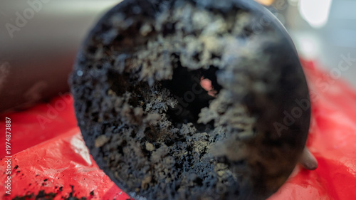 Part of the chimney pipe is almost completely filled with soot.