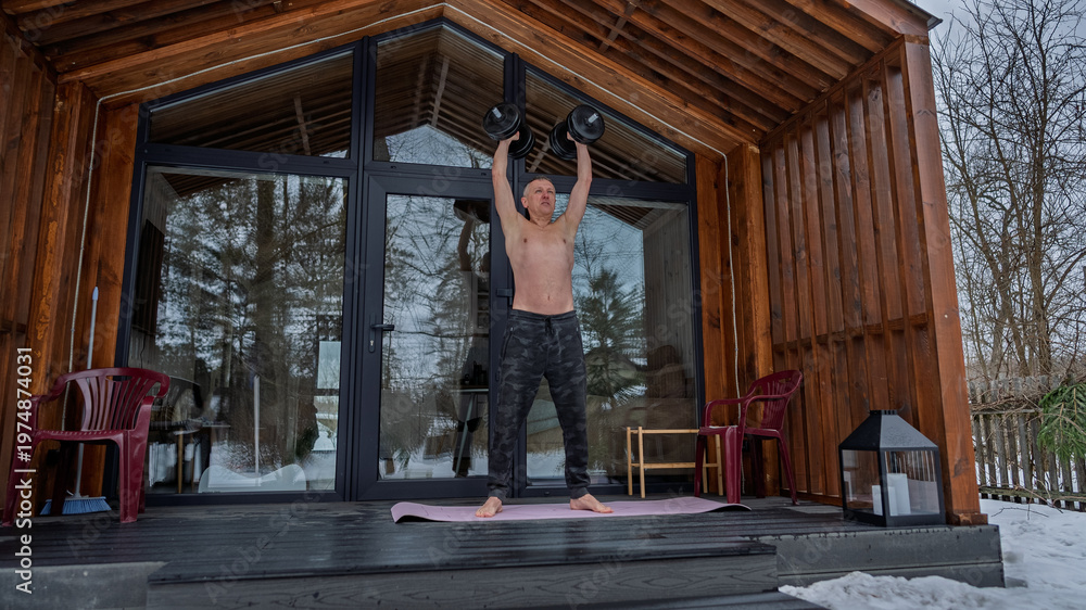 Fototapeta premium Exercising with dumbbells.