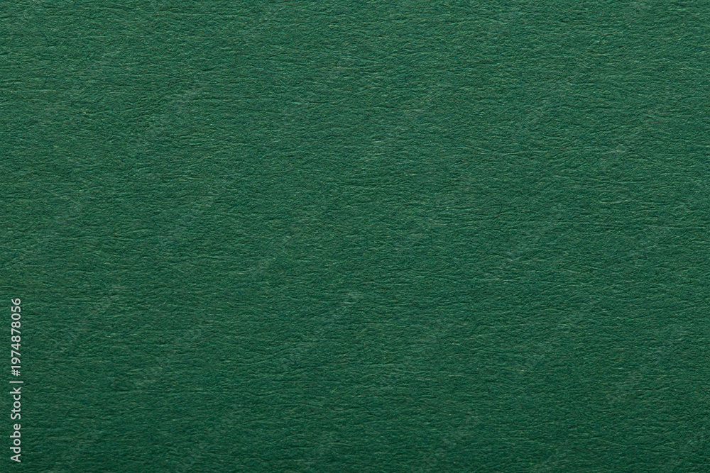 Fototapeta premium Dark green paper texture background. Rough blank canvas sheet surface for elegant luxury graphic design or Christmas card