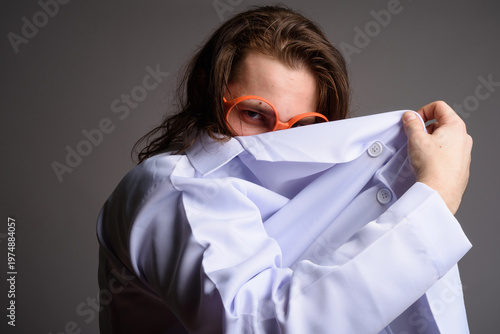 Mysterious Mad Scientist Hiding Behind Lab Coat - Secretive Man in Orange Glasses