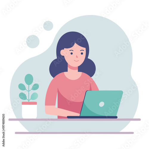 Woman working on laptop with plant on desk
