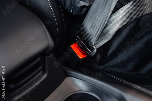 Εκτύπωση καμβά Close-up view of a car seatbelt buckle and strap secured in a modern vehicle int