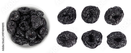 Fotografia Prunes in ceramic bowl isolated on white background, heap of dried plums