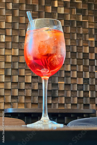 Aperol spritz cocktail in wine glass at restaurant table