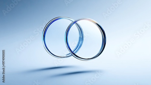 Two interlocking transparent rings with blue accents against a light blue gradient