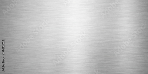 Industrial brushed metal texture background featuring a polished silver stainless steel plate with a shiny grey metallic surface and a seamless aluminum pattern