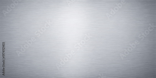 Shiny brushed stainless steel plate with a metallic silver texture and gray industrial pattern for a sleek aluminum alloy backdrop surface