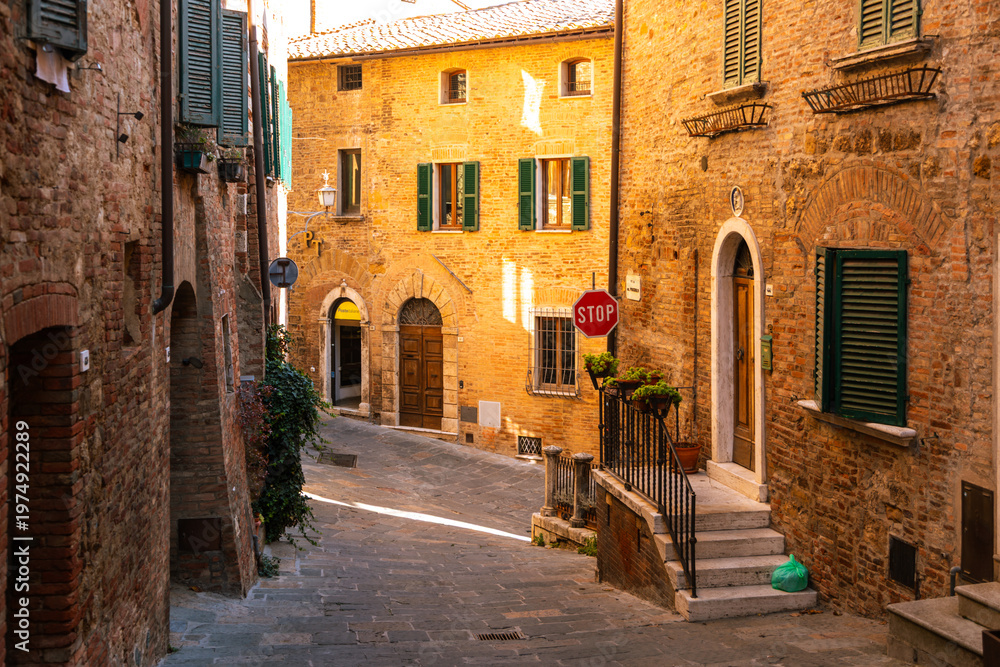 Fototapeta premium Charming Montepulciano alley winding through old Tuscan town, Italy.