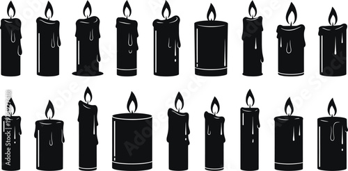 Collection of black candles with flickering flames decorative and symbolic lighting