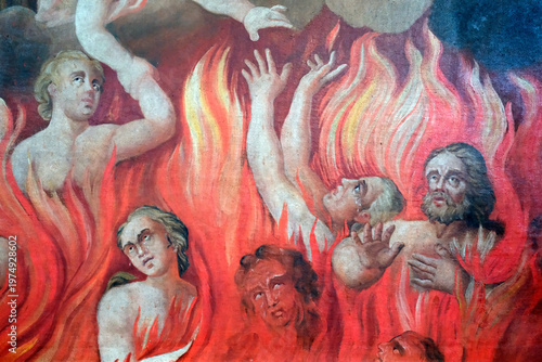 Saint Nicolas de Veroce church.  Baroque painting depicting tortured souls engulfed in flames, reaching upward toward divine salvation and redemption. Saint Nicolas de Veroce. France.