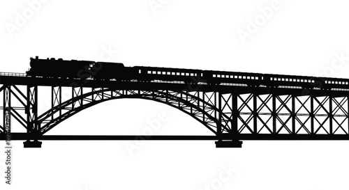 Vintage steam train crossing a large metal bridge striking black silhouette