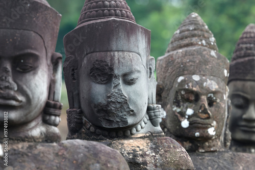 Tableau sur toile Carved stone statues aligned at South Gate to Angkor Thom, Angkor Wat