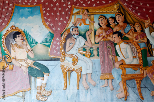 Wat Preah Prom Rath temple. Elder sage Asita examining infant Siddhartha, predicting his destiny as a great king or enlightened Buddha.  Siem Reap. Cambodia.