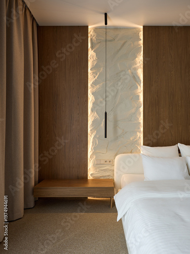 Modern and Cozy Hotel Bedroom Interior with Warm Lighting