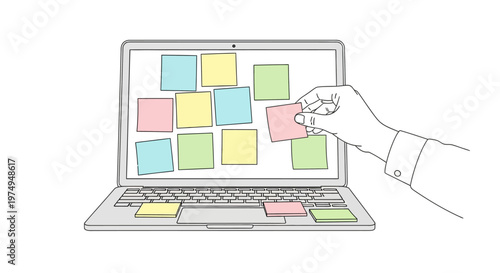 Hand placing sticky note on laptop.