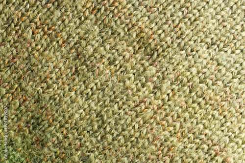 Full frame of the texture of knitted fabric made of wool thread.