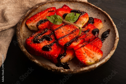 Savory Strawberries with Balsamic Cream and Black Pepper on Handmade Ceramic Plate