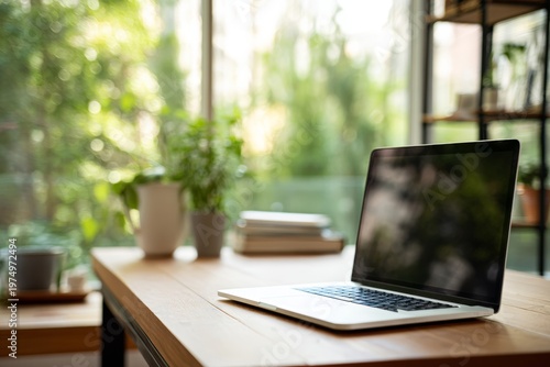 Modern Minimalist Home Office Setup With Laptop on Wooden Desk and Plants Near Window During Daylight