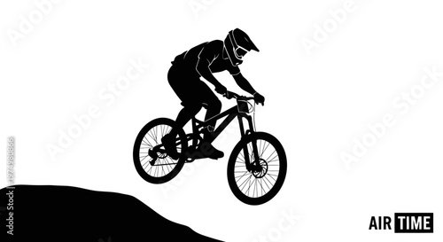 Dynamic Silhouette Of A Mountain Biker Mid-Air