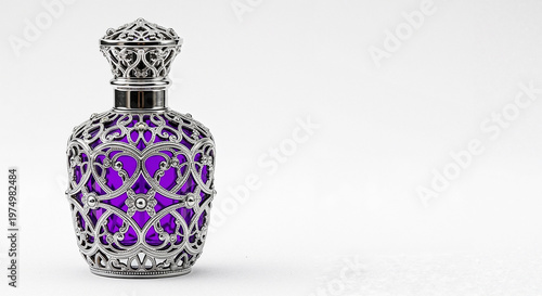 Decorative glass perfume bottle with intricate silver design  and copy space