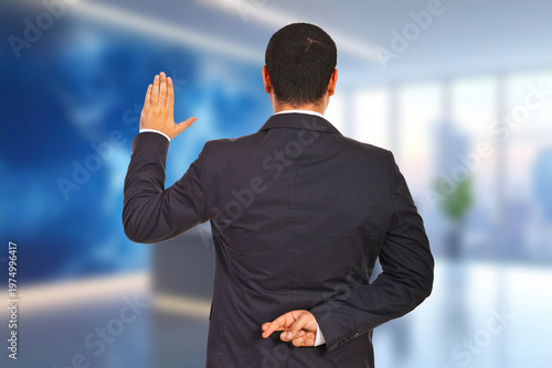 Man in suit turns away, palm raised, fingers crossed behind back