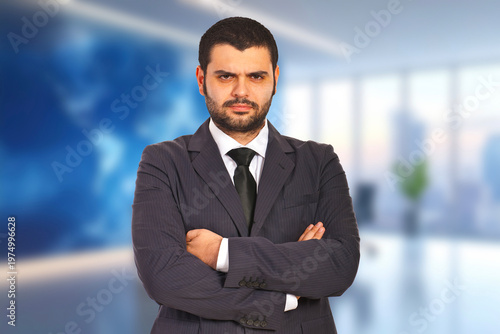 Confident man stands in modern office space