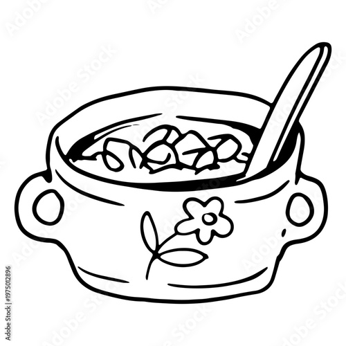 A bowl of soup in a floral-patterned cup