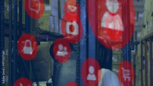Animated red icons shifting over forklift cabin, revealing white hard hat and warehouse shelves