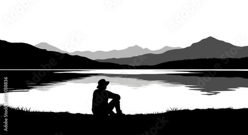 Silhouette of a lone person sitting peacefully wearing a wide brimmed hat.