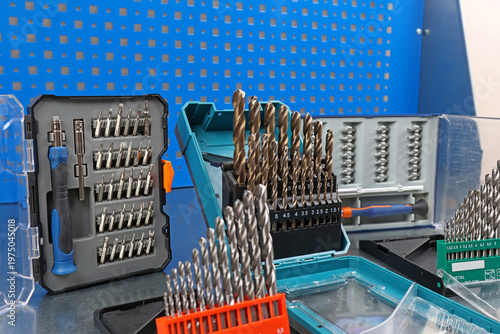 A set of drills for drilling metal in a plastic case.