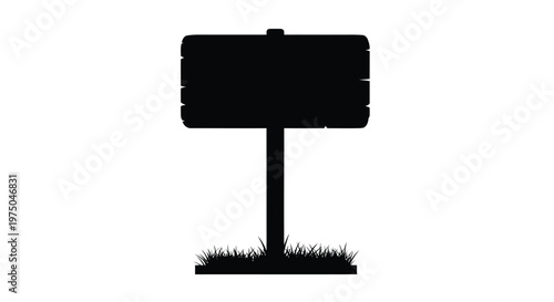 A black signpost with grass stands out against a white background silhouette
