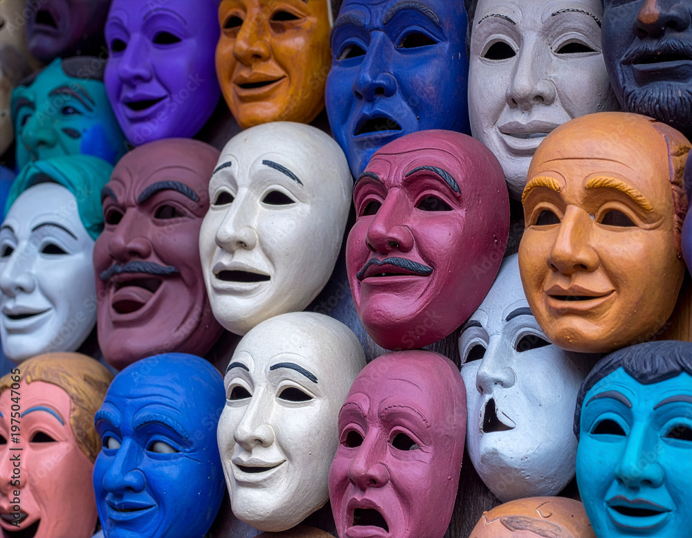 Obraz premium Closeup of colorful clay masks and faces with visible texture and sculpted forms, expressing different emotions.