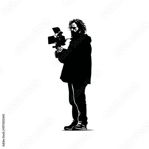 Silhouette of a person holding a video camera and filming.
