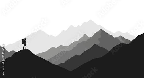 Silhouette of a lone hiker with a backpack standing on a mountain ridge.