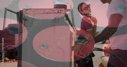 Animation of barrels over diverse couple at gas station