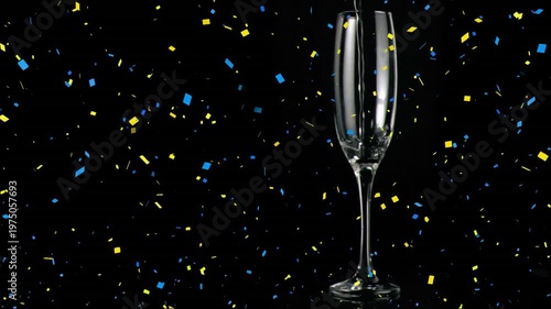 Flute filling up with champagne in slow motion against black background