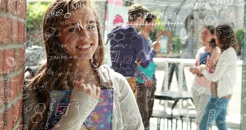Hearing chatter student shifting gaze out releasing notebook smiling as formula overlay persisting