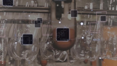 Conveyor starting moving bottles along rail while overlays tracking and nozzle inspecting quality