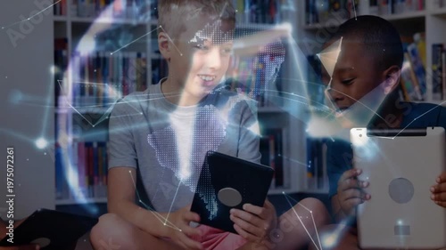 Three boys sitting in school library tapping tablets sharing content forming rotating network globe