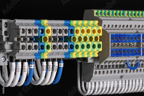 Electrical screw terminals for connecting copper electrical wires with metal lugs in electrical switchboard. 