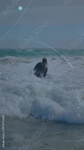 Vertical video: Surfer entering breaking surf bracing with board to reach deep water purple overlay
