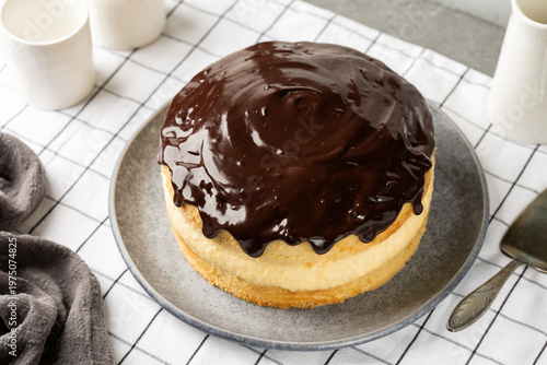 Fotografie High angel view of Homemade Boston cream pie, is a cake with a custard filling and chocolate glaze