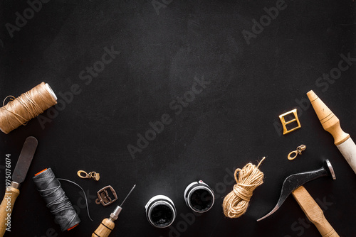 Leather craft or shoemaker tools flat lay. The workplace in a leather workshop