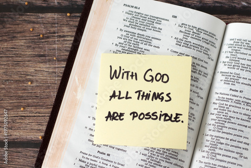 With God all things are possible, inspirational handwritten quote with mustard seeds and holy bible on wooden table. Faith and belief in Jesus Christ, biblical concept.