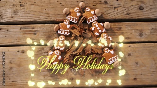 Overhead view of gingerbread cookies and cinnamon sticks forming christmas tree 4k