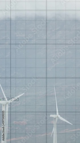 Vertical video: Readouts appearing, turbines rotating while trend lines rising to show performance