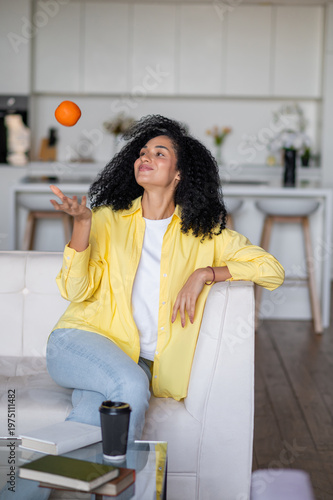 Photography Cute young woman sitting on thew sofa and feeling confident and happy