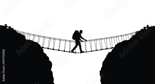 A lone hiker crosses a rope suspension bridge between two rocky hills silhouette